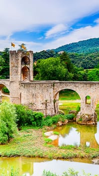 Romanesque bridge over the Fluvia river at Besalu, Girona, Catalonia.