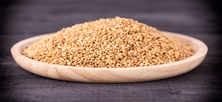 Sesame close up shot on wood background