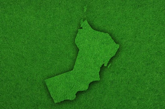 Map of Oman on green felt