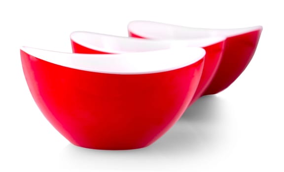 The three red plates on white background