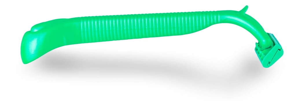 The Green plastic disposable shaver isolated on white