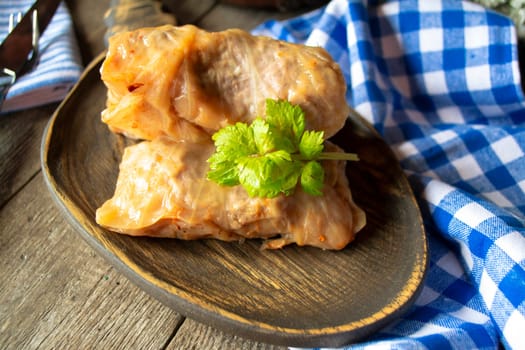 Healthy stuffed cabbage rolls with meat and carrots close up