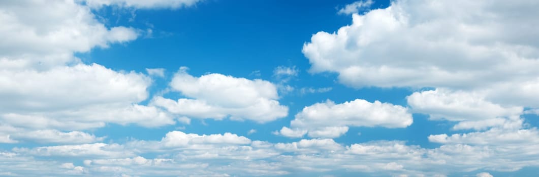white clouds on the blue sky on sunny day