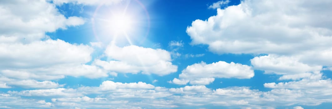 white clouds on the blue sky on sunny day
