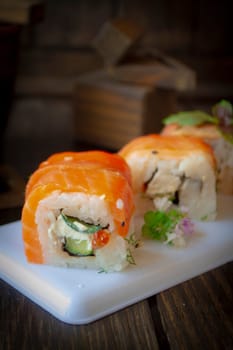 salmon sushi roll japanese food style, close up, vertical image