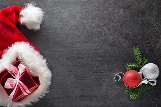 Christmas background with decorations objects and Santa's hat. Christmas, winter, new year concept.