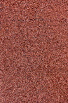 Background - roll tiles covered with red stone chips