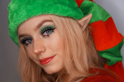 young blond woman portrait with christmas makeup.