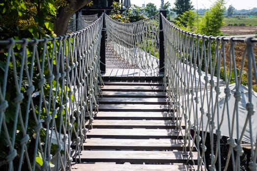 Canopy bridge on summer field, stock photo