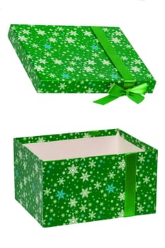 Gift box isolated. Close-up of a green present or gift box with ribbon bow isolated on a white background. Birthday, valentine, anniversary or other holidays. Macro photograph.