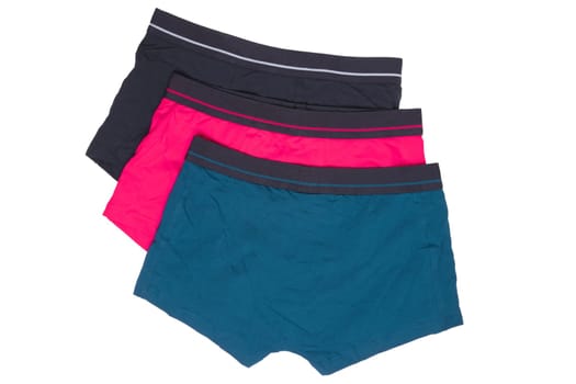 Male underwear isolated. Close-up of three casual boxer shorts isolated on a white background. Clipping path included. Fashionable mens underpants. Back view.