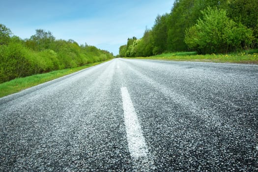 Asphalt road in beautiful spring day at countryside