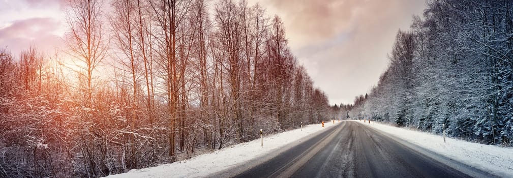 Car on winter road covered with snow