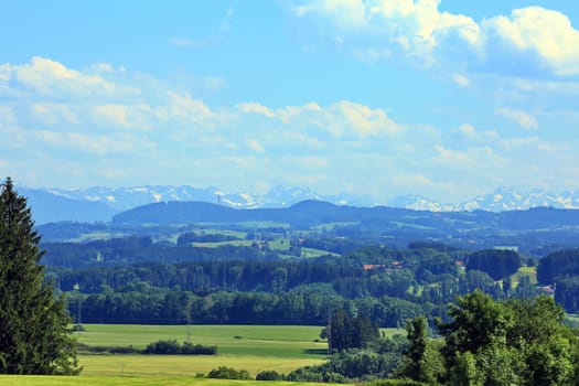 Alpine foothills with a view of the Alpine panorama