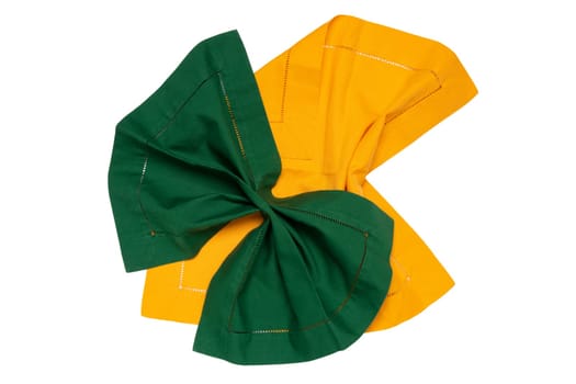 Top view of a folded yellow and a green kitchen cloth, textile, tablecloth or napkin isolated on a white background. Design element for your food product display montage.