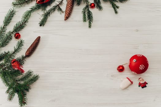 Christmas Decorations on a White Wooden Table with Copy Space Text