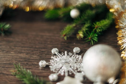 Decoration of Christmas Tree Green Branches on a Brown Background with Copy Space