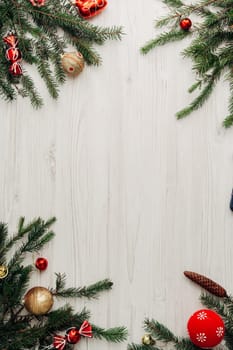Christmas Red Decorations on a White Wooden Table with Copy Space Text