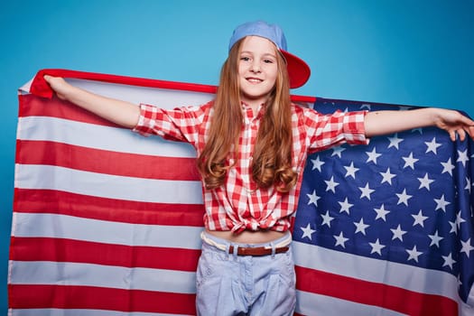 Pretty girl holding the American flag