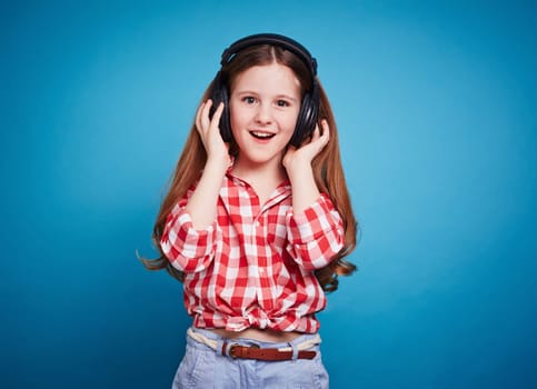 Happy girl with headphones listening to music