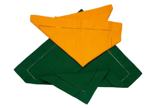 Closeup of a green and a yellow napkin or tablecloth isolated on white background. Kitchen accessories.