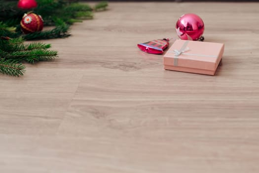 Decoration of Christmas Tree Green Branches on a Wooden Background with Copy Space