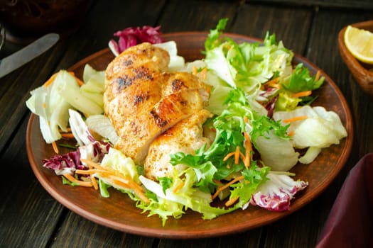 Grilled turkey fillet with vegetables on dark table, roast chicken