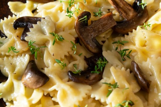 pasta with mushrooms and basil,with white wine, close up texture background
