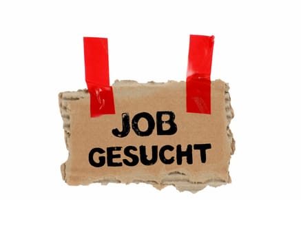 Old piece of cardboard with red tape showing: Job wanted in german language