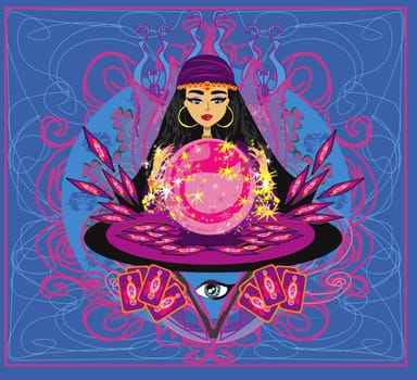 beautiful woman foretells the future from a glass ball and cards