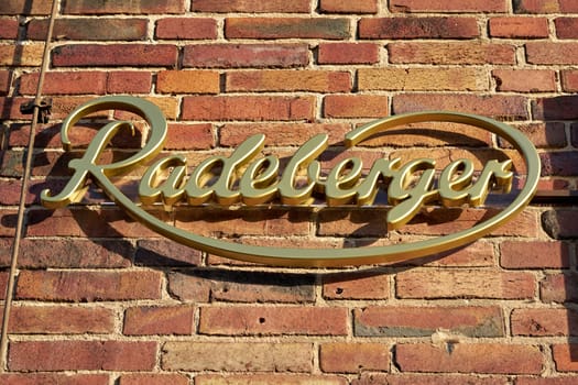 Lettering of the Radeberger beer brand on the facade of a restaurant in Germany