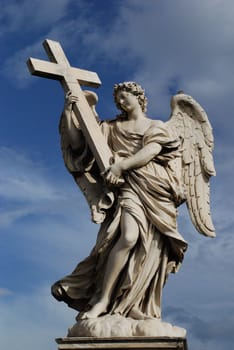 Angel with cross on the Angel's Bridge in Rome.