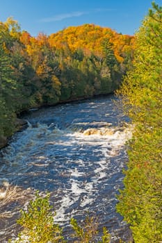 Roaring Falls in the Autumn Forest on the Piers Gorge Trail in Michigan
