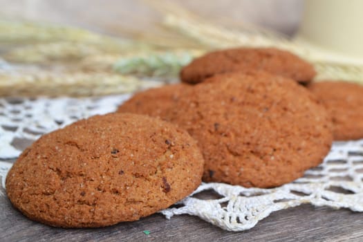 Homemade oatmeal cookies on rustic background closeup
