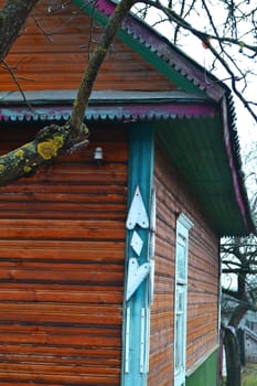Detail of a wooden wall of the old log house. Vertical image