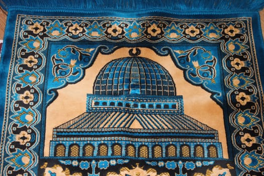 Closeup view of prayer rug in place to make prayer. High angle view of lovely prayer mat or prayer rug for Muslims