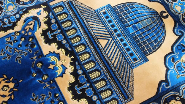 Closeup view of prayer rug in place to make prayer. High angle view of lovely prayer mat or prayer rug for Muslims