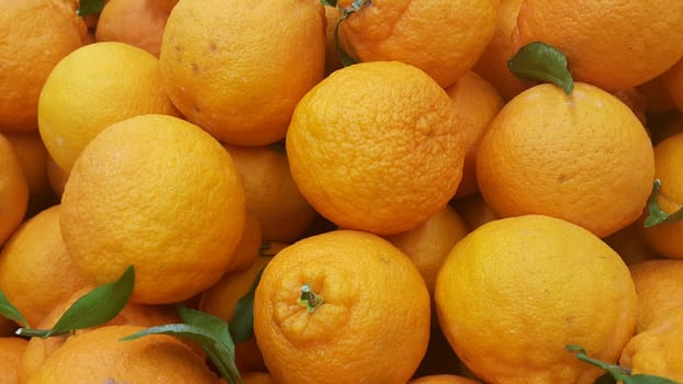 Healthy, fresh organic oranges in supermarket for sale, pile of orange in market for texture