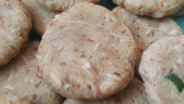Spicy and tasty uncooked kebab stuffed with minced meat, onion,  alo paste and chana. Asian spicy cuisine.
