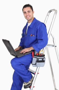 Male artisan worker with laptop