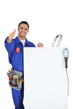 artisan near a white panel doing thumbs up