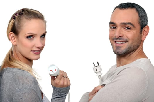 Couple holding electrical cable