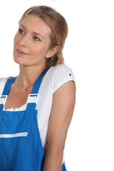 Woman in blue work dungarees