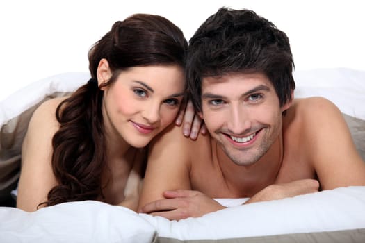 Portrait of a young couple in bed