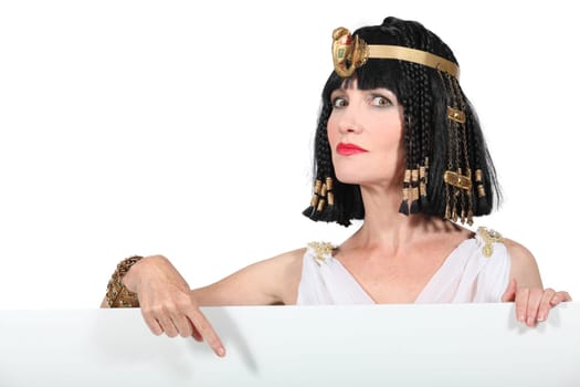 Cleopatra pointing at blank advertising board