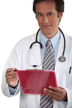 Doctor smiling with clipboard