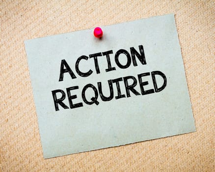Recycled paper note pinned on cork board.Don' t Postpone Message. Motivational Concept Image