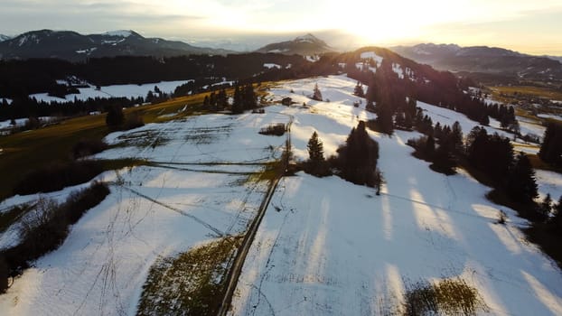 Winter drone photo of the Allgäu Alps with the Grünten in the backlight of the sun