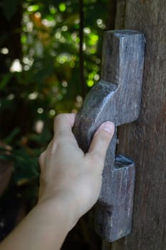 Hand on vintage wooden door, stock photo