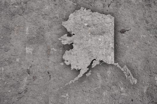 Map of Alaska on weathered concrete